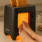 Thermo-Toaster 3000 Deluxe | Toaster, Fußwärmer, Karaoke-Maschine